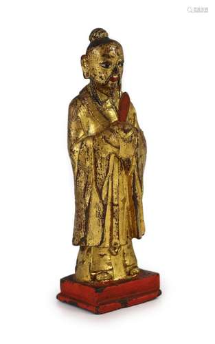 A Chinese Ming lacquered bronze figure of an official holdin...