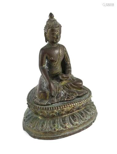 A Nepalese or Tibetan gilt copper alloy figure of Buddha Sha...