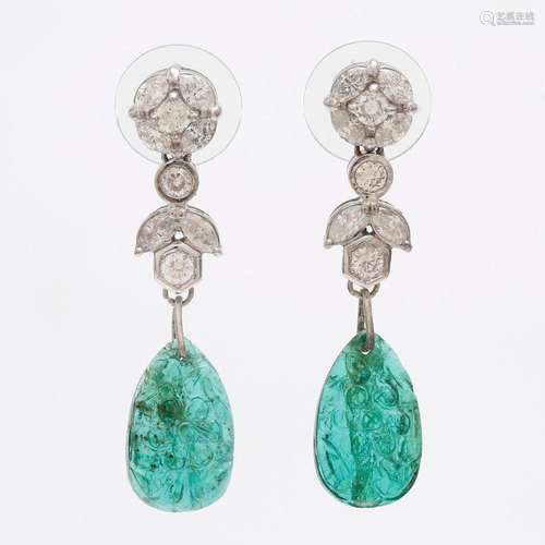 Emeralds and diamonds long earrings.