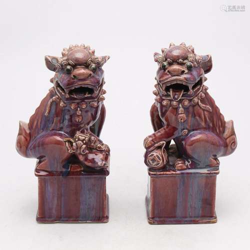 Pair of Chinese Foo Dogs in flambé porcelain, 20th Century.