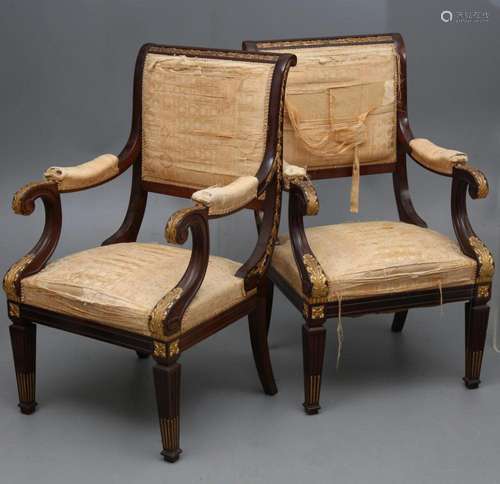 Pair of Directoire style armchairs in partially carved and g...