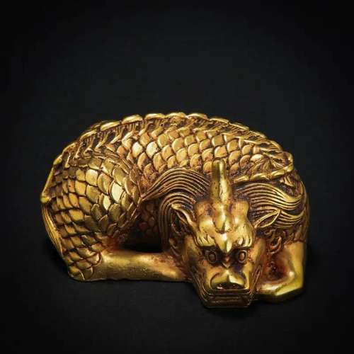 A Chinese Bronze-gilt Beast Shaped Paper Weight