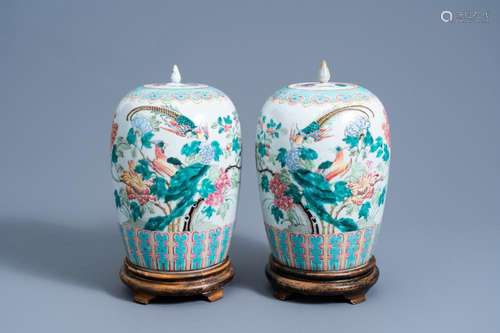 A PAIR OF CHINESE FAMILLE ROSE JARS AND COVERS WITH BIRDS AM...