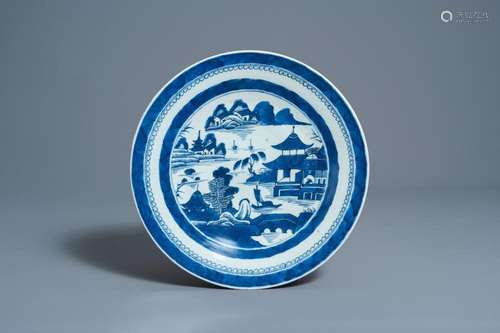 A CHINESE BLUE AND WHITE CHARGER WITH A RIVER LANDSCAPE, JIA...