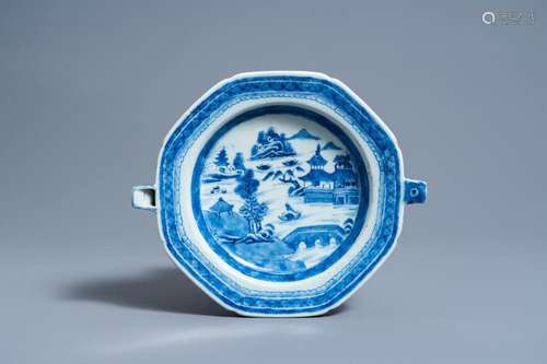 A CHINESE BLUE AND WHITE WARMING PLATE WITH A RIVER LANDSCAP...