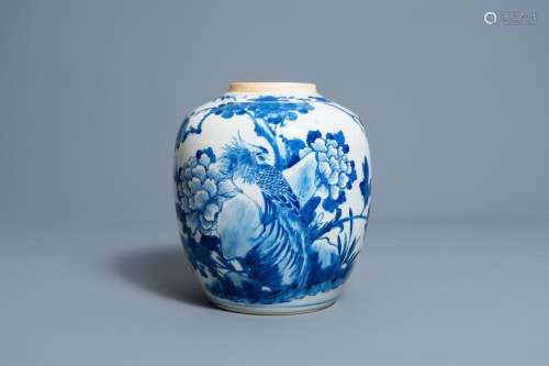 A CHINESE BLUE AND WHITE JAR WITH A PHEASANT AMONG BLOSSOMIN...