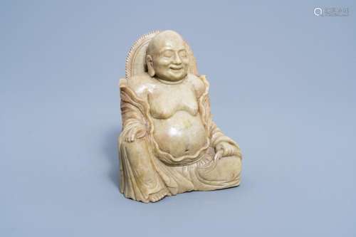 A CHINESE CARVED SOAPSTONE FIGURE OF A LAUGHING BUDDHA, 20TH...