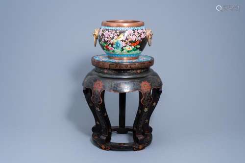 A CHINESE LACQUERED WOOD STAND WITH CLOISONNÉ TOP WITH A CRA...