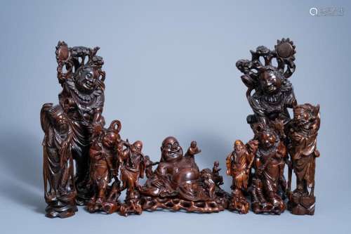 A VARIED COLLECTION OF NINE CHINESE CARVED WOOD FIGURES, 19T...
