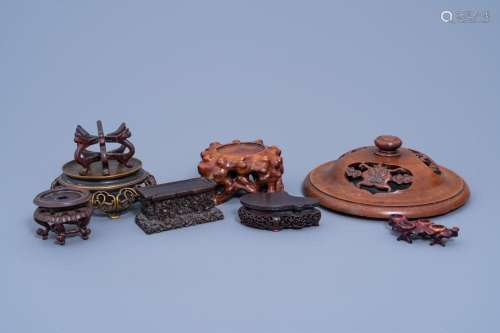 A COLLECTION OF CHINESE CARVED WOOD AND BRONZE STANDS AND A ...