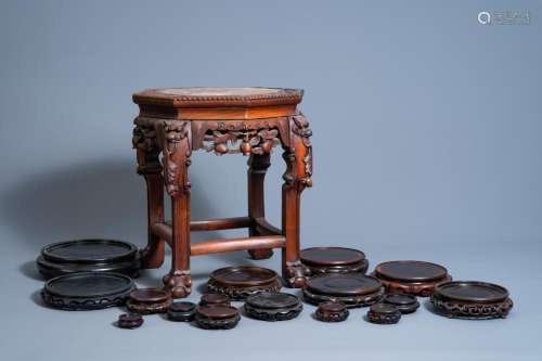 A COLLECTION OF CHINESE CARVED WOOD STANDS, ONE OF WHICH WIT...
