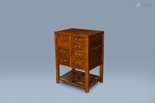 A CHINESE WOOD SIDE TABLE WITH SEVEN DRAWERS, 19TH/20TH C.