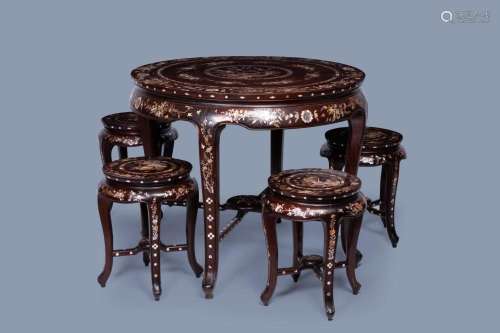 A WOOD TABLE AND FOUR CHAIRS INLAID WITH MOTHER-OF-PEARL WIT...