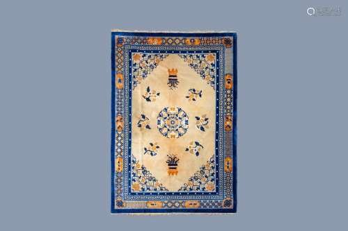 A CHINESE WOOLEN 'BEIJING' RUG WITH FLORAL DESIGN, C...
