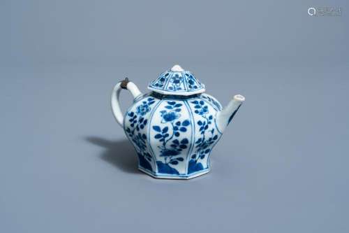 A CHINESE BLUE AND WHITE TEAPOT AND COVER WITH FLORAL DESIGN...