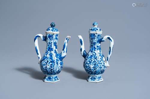 A PAIR OF CHINESE BLUE AND WHITE WINE JUGS WITH FLORAL DESIG...