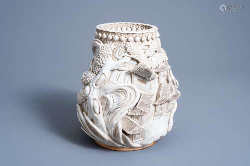 A CHINESE MONOCHROME WHITE NANKING VASE WITH LANDSCAPE RELIE...