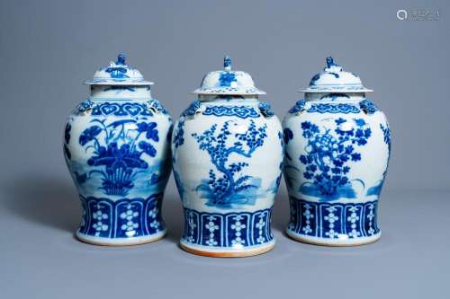 THREE CHINESE BLUE AND WHITE VASES AND COVERS WITH FLORAL DE...