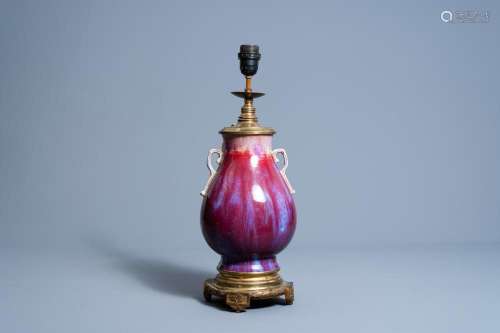 A CHINESE FLAMBÉ GLAZED 'HU' VASE MOUNTED AS A LAMP,...