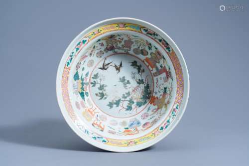 A CHINESE FAMILLE ROSE BOWL WITH BIRDS AMONG BLOSSOMING BRAN...