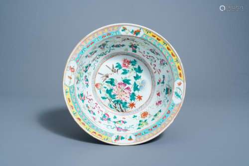 A CHINESE FAMILLE ROSE BOWL WITH BIRDS AMONG BLOSSOMING BRAN...