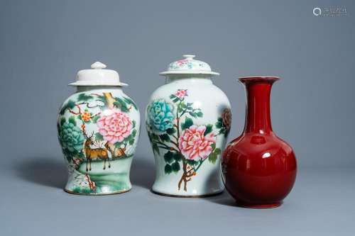 A PAIR OF CHINESE FAMILLE ROSE VASES AND COVERS WITH FLORAL ...