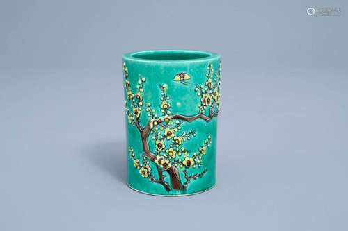 A CHINESE GREEN GROUND BRUSH POT WITH FLORAL RELIEF DESIGN, ...