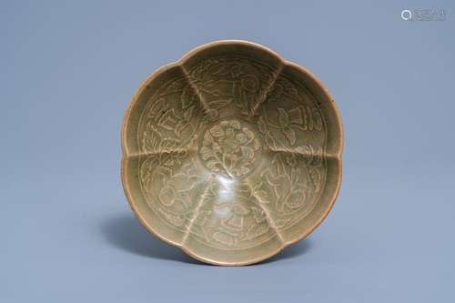 A CHINESE LOTUS-SHAPED CELADON-GLAZED BOWL WITH FLORAL SPRIG...