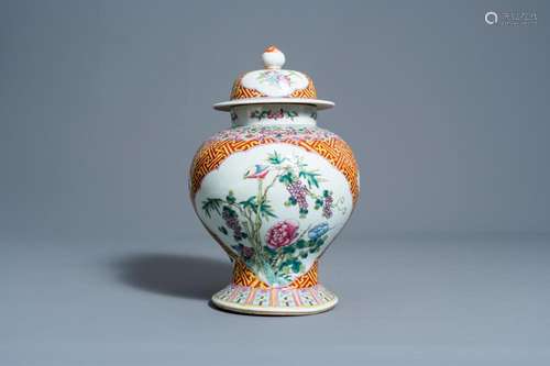 A CHINESE FAMILLE ROSE VASE AND COVER WITH BIRDS AMONG BLOSS...