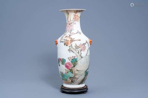 A CHINESE QIANJIANG CAI VASE WITH BIRDS AMONG BLOSSOMING BRA...