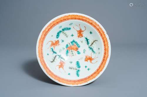 A CHINESE FAMILLE VERTE 'DRAGONS AND FISH' BOWL ON F...