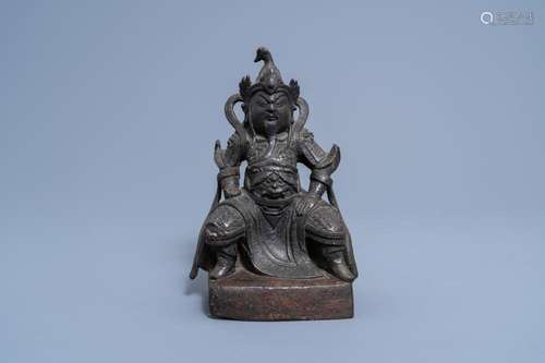 A CHINESE BRONZE FIGURE OF A SEATED DIGNITARY, MING