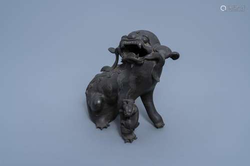 A CHINESE BRONZE MODEL OF A BUDDHIST LION WITH CUB, QING