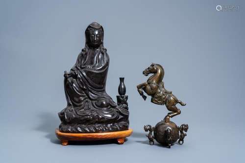 A CHINESE BRONZE FIGURE OF GUANYIN AND A HORSE, 19TH/20TH C.