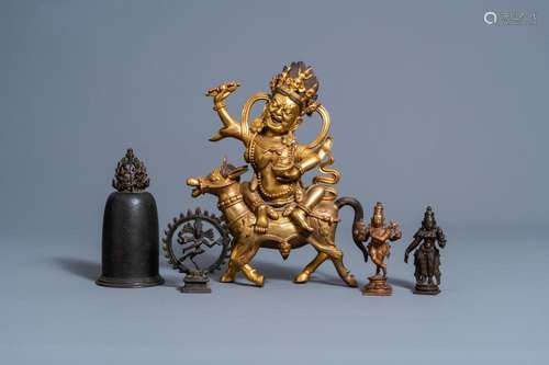 A SINO-TIBETAN GILT BRONZE FIGURE OF MAHAKALA ON HORSEBACK, ...