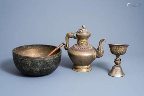 A TIBETAN COPPER TEAPOT, A HEALING BOWL AND A RITUAL BOWL ON...