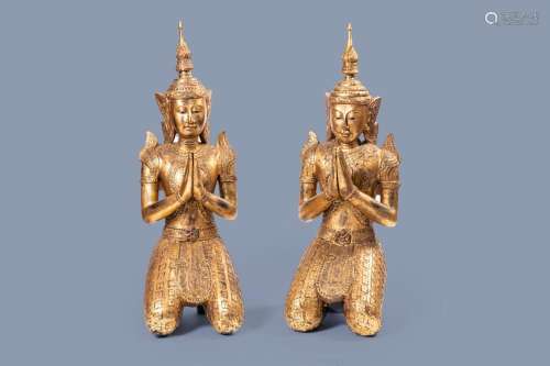 A PAIR OF TALL INLAID GILT WOOD FIGURES OF A KNEELING BUDDHA...