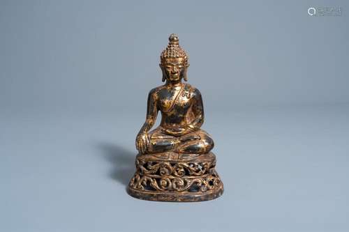 A GILT-LACQUERED BRONZE FIGURE OF BUDDHA SHAKYAMUNI ON A RET...