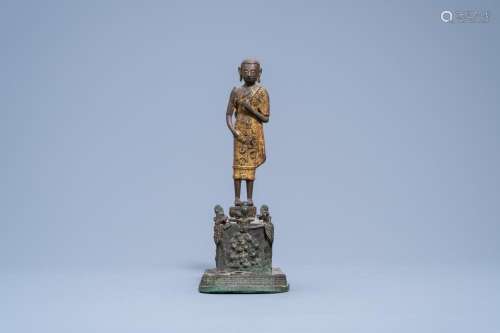 A GILT LACQUERED BRONZE FIGURE OF PHRA MALAI VISITING BUDDHI...