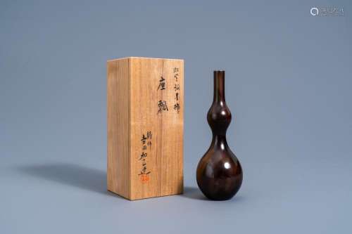 A JAPANESE BRONZE DOUBLE GOURD VASE WITH FLAMED BROWN PATINA...