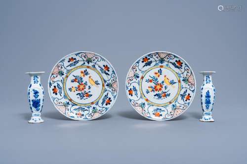 A PAIR OF DUTCH DELFT POLYCHROME PLATES WITH A BIRD ON A BLO...