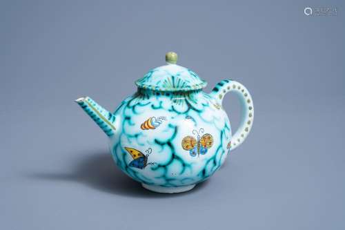 A BRUSSELS FAIENCE TEAPOT AND COVER WITH BUTTERFLIES AND CAT...