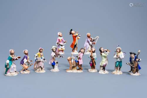 A TWELVE-PIECE MONKEY ORCHESTRA IN POLYCHROME DECORATED SAXO...