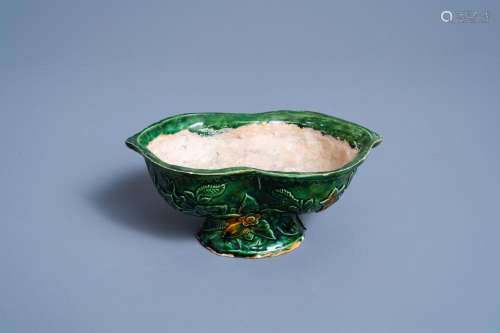 A FRENCH GREEN GLAZED LOBED BOWL ON FOOT WITH FLORAL DESIGN,...