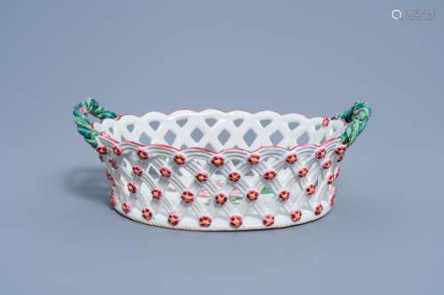 A FRENCH RETICULATED FAIENCE DE L'EST BASKET WITH FLORAL...