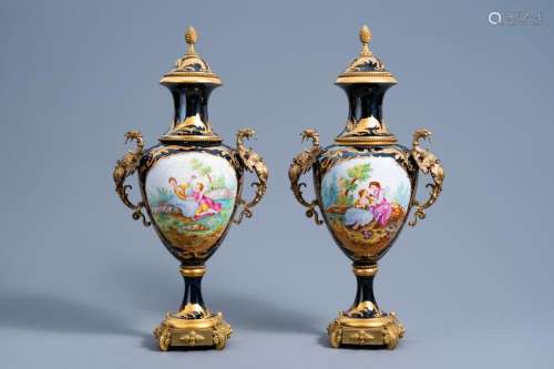 A PAIR OF FRENCH GILT BRONZE MOUNTED GOLD LAYERED BLUE GROUN...