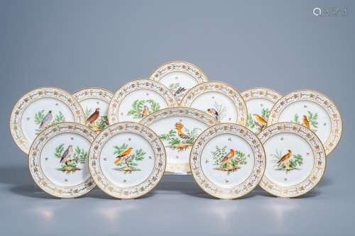 A SET OF ELEVEN FRENCH PLATES AND ONE OVAL CHARGER WITH GILT...