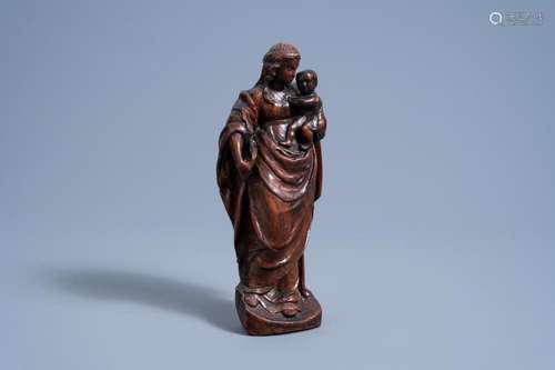 A MOST PROBABLY FLEMISH CARVED WOOD VIRGIN AND CHILD, CA. 16...