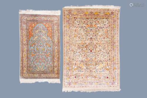 TWO ORIENTAL RUGS WITH ANIMALS BETWEEN BLOSSOMING BRANCHES, ...