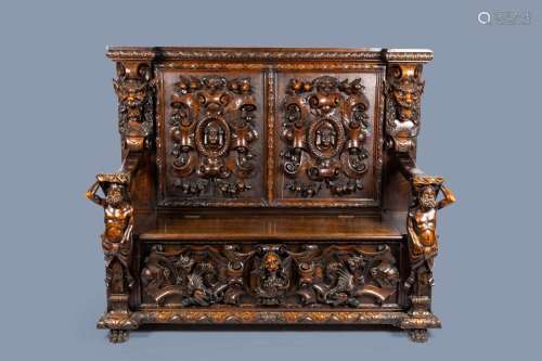 AN ITALIAN RICHLY CARVED WOOD CHEST OR SETTLE WITH ATLANTES ...